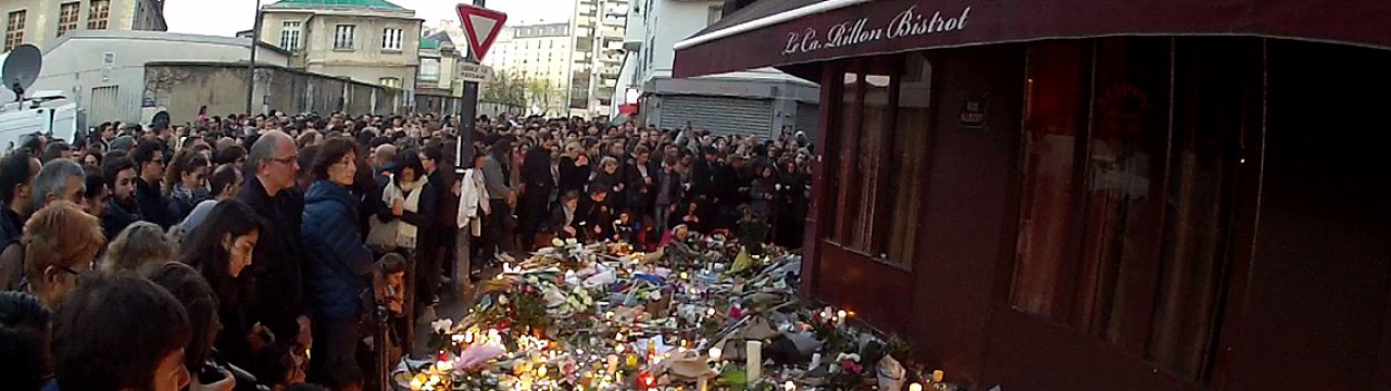 Group of people in front of café le carillon after the Paris attacks